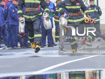 Firefighters are conducting a fire drill at the Qianyuan fire prevention and rescue station in Deqing County, Huzhou City, Zhejiang Province...