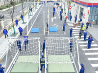 Firefighters are conducting a fire drill at the Qianyuan fire prevention and rescue station in Deqing County, Huzhou City, Zhejiang Province...