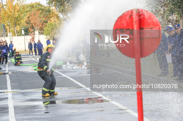 Firefighters are conducting a fire drill at the Qianyuan fire prevention and rescue station in Deqing County, Huzhou City, Zhejiang Province...