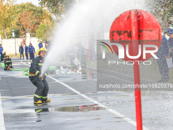 Firefighters are conducting a fire drill at the Qianyuan fire prevention and rescue station in Deqing County, Huzhou City, Zhejiang Province...