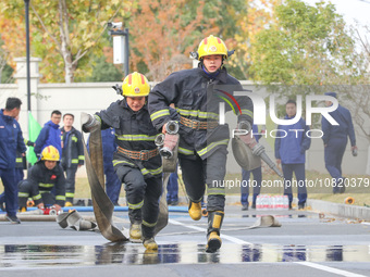 Firefighters are conducting a fire drill at the Qianyuan fire prevention and rescue station in Deqing County, Huzhou City, Zhejiang Province...