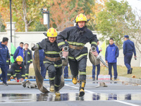 Firefighters are conducting a fire drill at the Qianyuan fire prevention and rescue station in Deqing County, Huzhou City, Zhejiang Province...