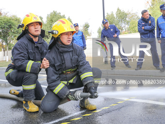 Firefighters are conducting a fire drill at the Qianyuan fire prevention and rescue station in Deqing County, Huzhou City, Zhejiang Province...