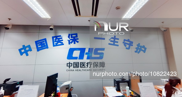 A community service center for China Medical Insurance (Medical security) is operating with an office window and self-service area in Shangh...