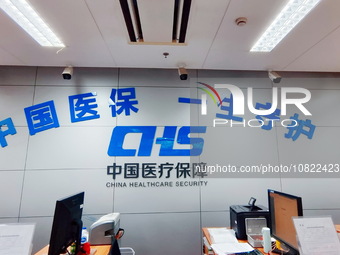 A community service center for China Medical Insurance (Medical security) is operating with an office window and self-service area in Shangh...