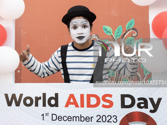 A mime artist is posing for a photograph during an event to mark World AIDS Day in Guwahati, Assam, India, on December 1, 2023. (