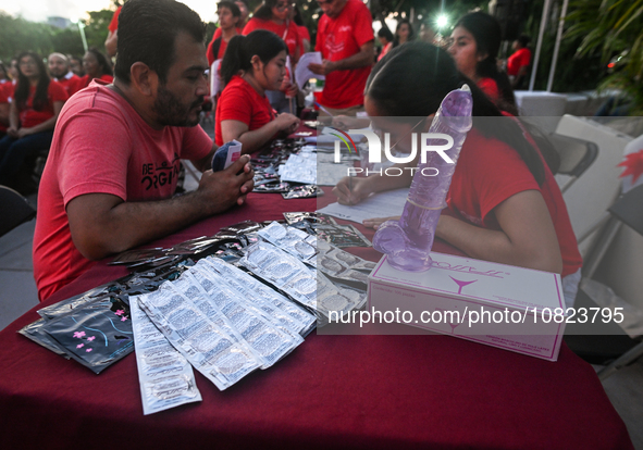 CANCUN, MEXICO - DECEMBER 1, 2023: 
A stand with free contraception prducts offered to participants of the World AIDS Day March in Cancun, o...