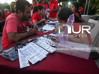 CANCUN, MEXICO - DECEMBER 1, 2023: 
A stand with free contraception prducts offered to participants of the World AIDS Day March in Cancun, o...