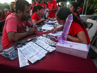 CANCUN, MEXICO - DECEMBER 1, 2023: 
A stand with free contraception prducts offered to participants of the World AIDS Day March in Cancun, o...