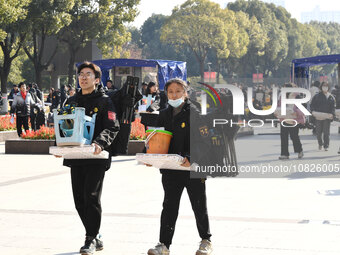 Candidates are walking into a test room to take the Jiangsu Provincial Unified Examination for Fine Arts and Art Design at the test center o...