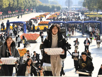 Candidates are walking into a test room to take the Jiangsu Provincial Unified Examination for Fine Arts and Art Design at the test center o...