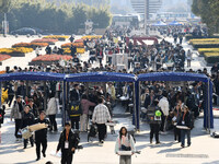 Candidates for the Jiangsu Provincial Unified Examination of Fine Arts and Art Design are passing through the intelligent security gate at t...