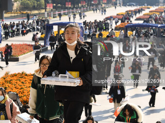 Candidates are walking into a test room to take the Jiangsu Provincial Unified Examination for Fine Arts and Art Design at the test center o...