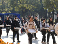 Candidates are walking into a test room to take the Jiangsu Provincial Unified Examination for Fine Arts and Art Design at the test center o...