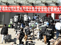 Candidates are walking into a test room to take the Jiangsu Provincial Unified Examination for Fine Arts and Art Design at the test center o...