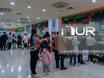 Parents and children with respiratory infectious diseases are waiting to see a doctor at the Children's Hospital in Chongqing, China, on Dec...