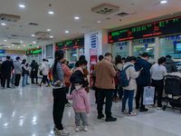 Parents and children with respiratory infectious diseases are waiting to see a doctor at the Children's Hospital in Chongqing, China, on Dec...