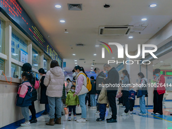 Parents and children with respiratory infectious diseases are waiting to see a doctor at the Children's Hospital in Chongqing, China, on Dec...