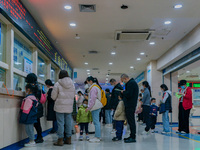 Parents and children with respiratory infectious diseases are waiting to see a doctor at the Children's Hospital in Chongqing, China, on Dec...