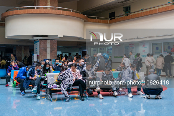 Parents and children with respiratory infectious diseases are waiting to see a doctor at the Children's Hospital in Chongqing, China, on Dec...