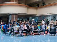 Parents and children with respiratory infectious diseases are waiting to see a doctor at the Children's Hospital in Chongqing, China, on Dec...