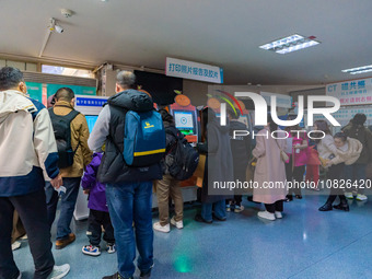 Parents and children with respiratory infectious diseases are waiting to see a doctor at the Children's Hospital in Chongqing, China, on Dec...