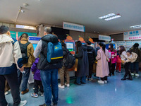 Parents and children with respiratory infectious diseases are waiting to see a doctor at the Children's Hospital in Chongqing, China, on Dec...