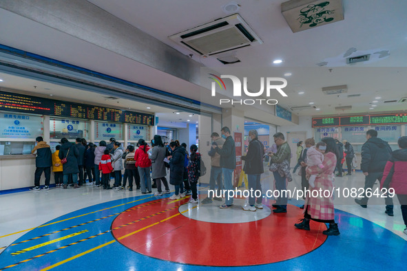 Parents and children with respiratory infectious diseases are waiting to see a doctor at the Children's Hospital in Chongqing, China, on Dec...