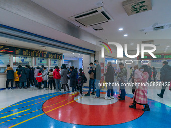 Parents and children with respiratory infectious diseases are waiting to see a doctor at the Children's Hospital in Chongqing, China, on Dec...