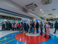 Parents and children with respiratory infectious diseases are waiting to see a doctor at the Children's Hospital in Chongqing, China, on Dec...