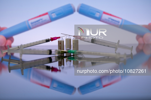 Ozempic by Novo Nordisk is being displayed on a screen alongside pills and a medical vial with a syringe in this photo illustration taken in...