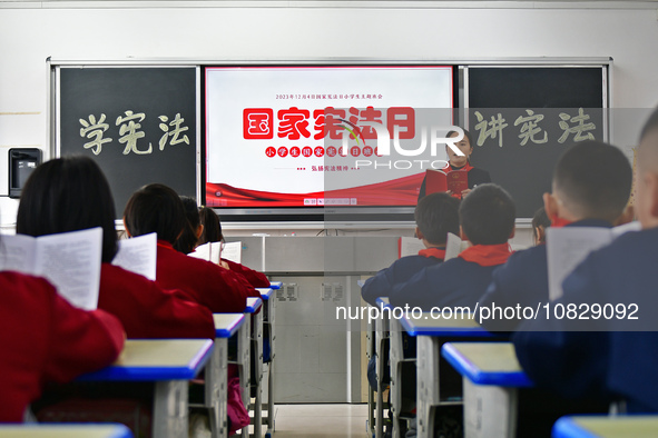 A teacher is leading students in reading the Constitution at Xiguan Primary School in the Fushan District of Yantai, Shandong Province, Chin...