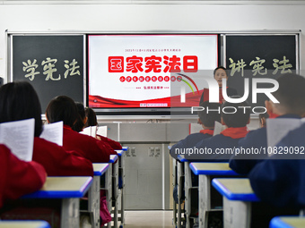 A teacher is leading students in reading the Constitution at Xiguan Primary School in the Fushan District of Yantai, Shandong Province, Chin...