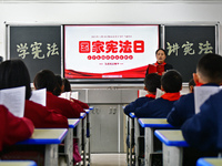 A teacher is leading students in reading the Constitution at Xiguan Primary School in the Fushan District of Yantai, Shandong Province, Chin...