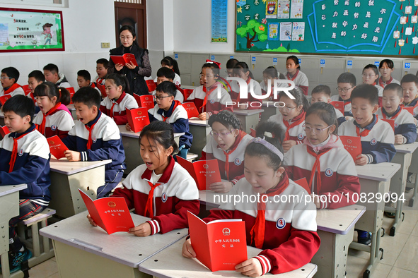 A teacher is leading students in reading the Constitution at Xiguan Primary School in the Fushan District of Yantai, Shandong Province, Chin...