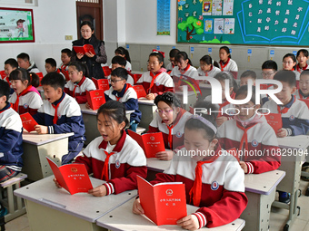 A teacher is leading students in reading the Constitution at Xiguan Primary School in the Fushan District of Yantai, Shandong Province, Chin...