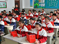 A teacher is leading students in reading the Constitution at Xiguan Primary School in the Fushan District of Yantai, Shandong Province, Chin...