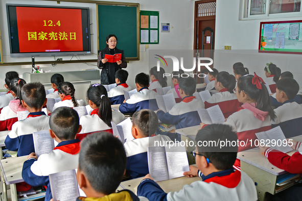 A teacher is leading students in reading the Constitution at Xiguan Primary School in the Fushan District of Yantai, Shandong Province, Chin...