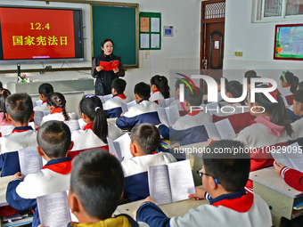 A teacher is leading students in reading the Constitution at Xiguan Primary School in the Fushan District of Yantai, Shandong Province, Chin...