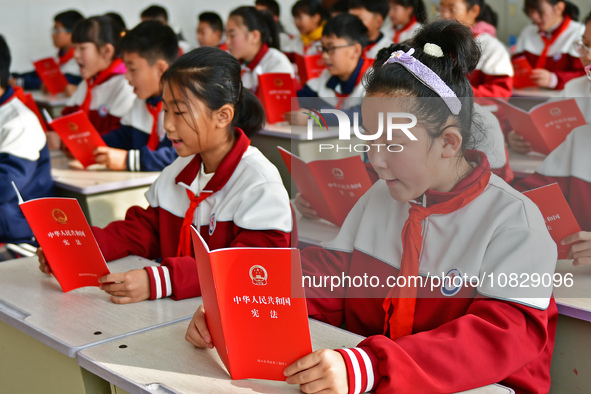 A teacher is leading students in reading the Constitution at Xiguan Primary School in the Fushan District of Yantai, Shandong Province, Chin...