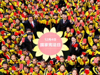 A judge is celebrating the Constitution with students at Wenhua Road Primary School in Zaozhuang, Shandong Province, China, on December 4, 2...