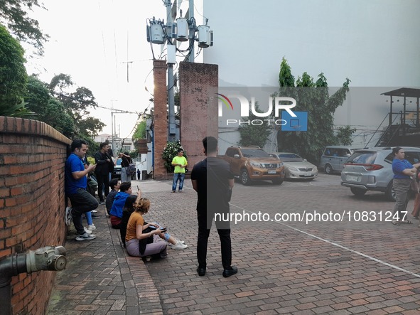 Officr Workers And Studentd Stand Outside After An Earthquake Was Felt In Manila, Philippines On December 5, 2023. A Magnitude 5.9 Earthquak...