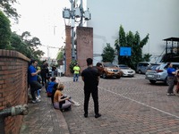 Officr Workers And Studentd Stand Outside After An Earthquake Was Felt In Manila, Philippines On December 5, 2023. A Magnitude 5.9 Earthquak...