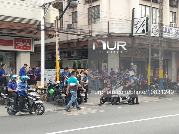 Officr Workers And Studentd Stand Outside After An Earthquake Was Felt In Manila, Philippines On December 5, 2023. A Magnitude 5.9 Earthquak...