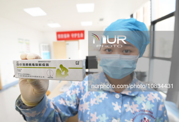 A medical worker at a community health service center is showing a flu vaccine in Guiyang, Guizhou Province, China, on December 7, 2023. 