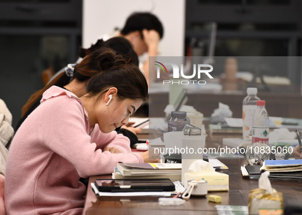 College students are reviewing for exams at the library of Nanjing Forestry University in Nanjing, China, on December 7, 2023. 