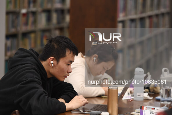 College students are reviewing for exams at the library of Nanjing Forestry University in Nanjing, China, on December 7, 2023. 