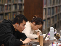 College students are reviewing for exams at the library of Nanjing Forestry University in Nanjing, China, on December 7, 2023. (