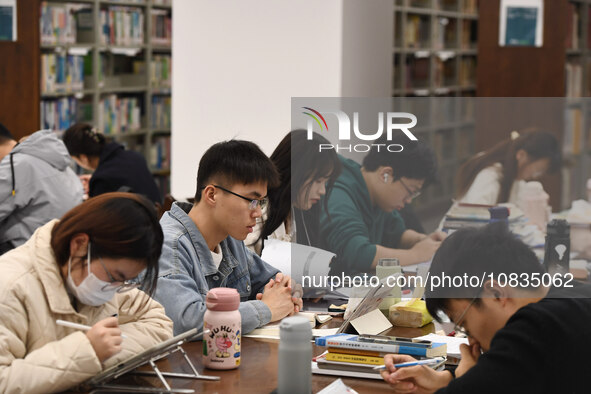 College students are reviewing for exams at the library of Nanjing Forestry University in Nanjing, China, on December 7, 2023. 