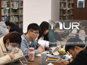 College students are reviewing for exams at the library of Nanjing Forestry University in Nanjing, China, on December 7, 2023. (